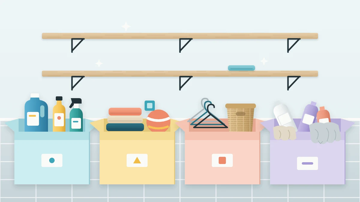 Four open boxes in a row on a laundry room floor holding bottles, towels and a toy, hangers and a basket, and worn rags