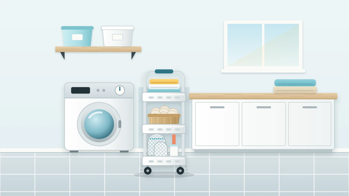 A slim white three-tier rolling cart pulled halfway out from beside a washer, holding folded cloths, wool dryer balls, mesh bags and a lint roller