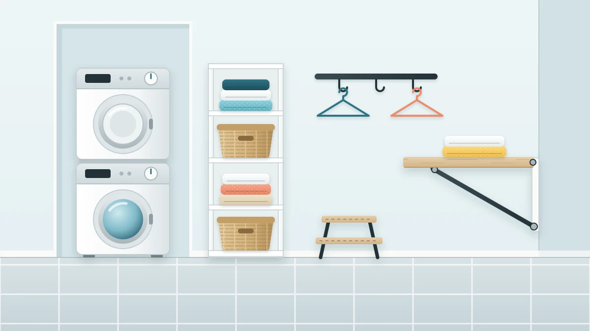 A white stacked washer and dryer in an alcove with a tall narrow shelving unit beside it, a fold-down wooden table on the opposite wall and a small step stool